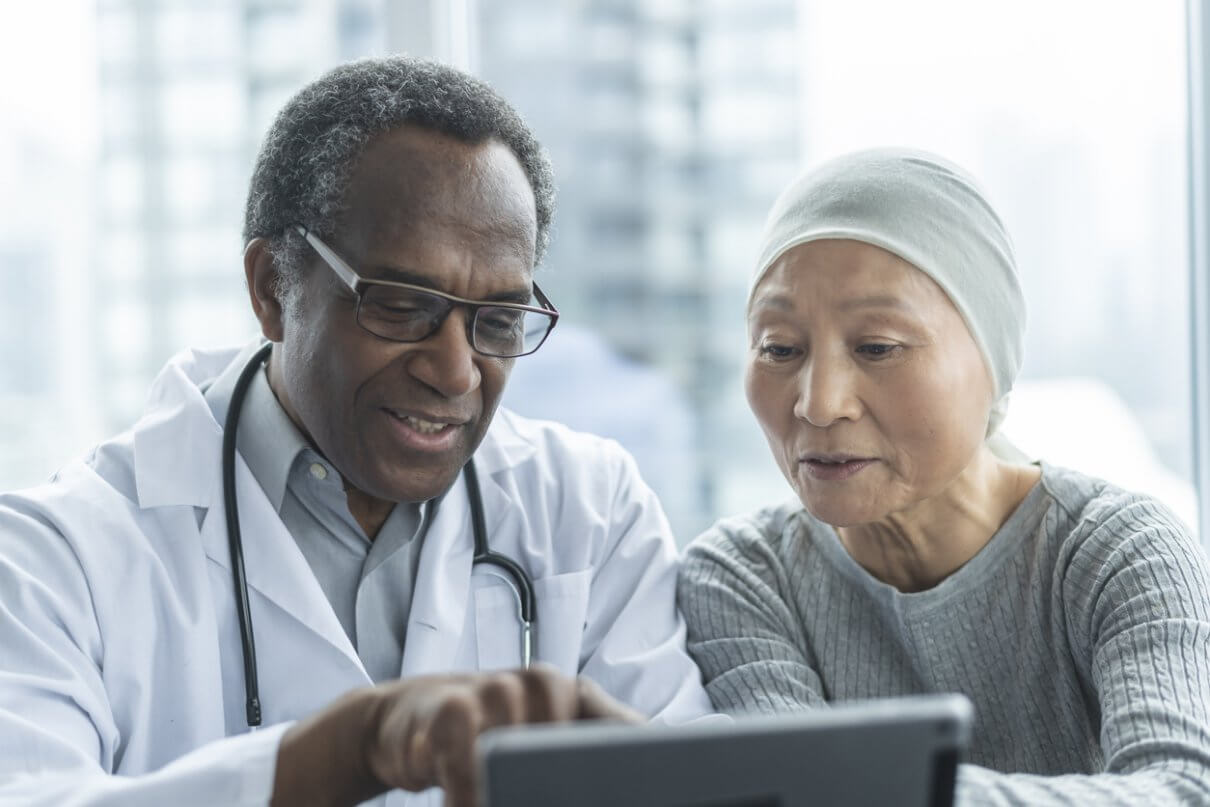 cancer patient reviewing options with doctor