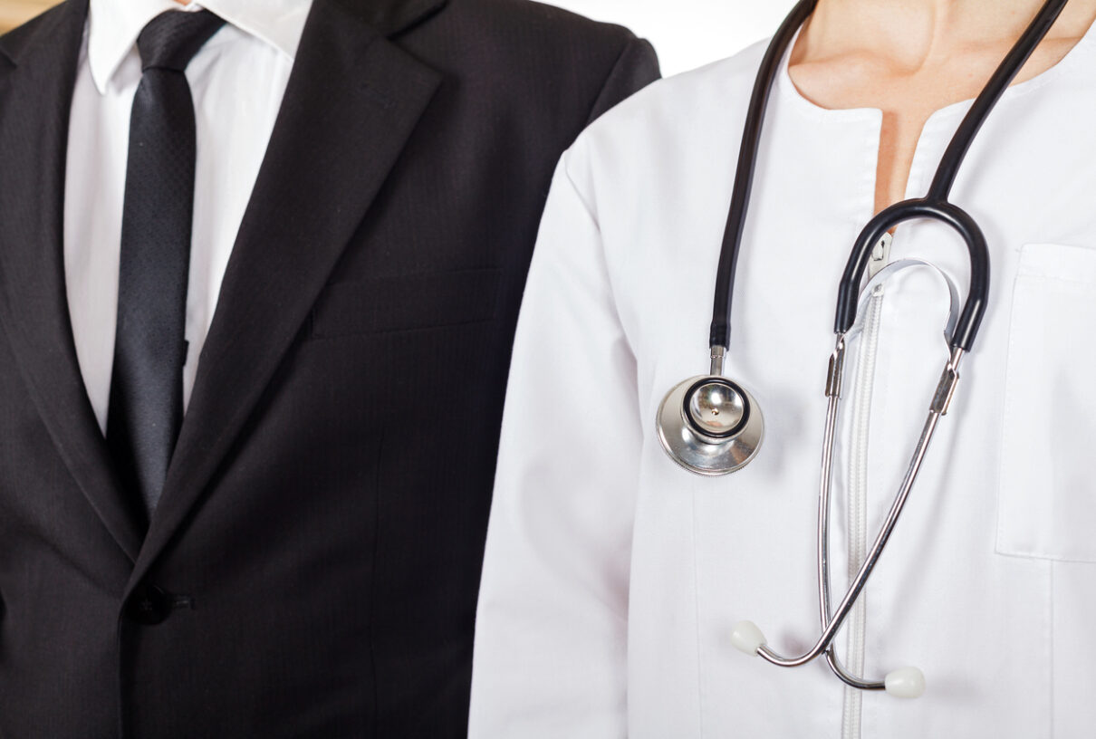 Young doctor and lawyer have a meeting to discuss medical malpractice cases
